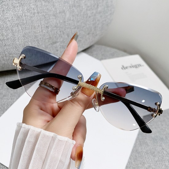 New fashionable rimless cat-eye sunglasses for women, high-end, personalized street style glasses.